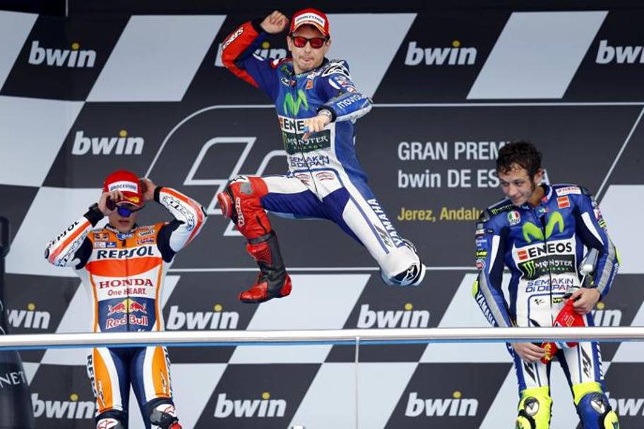 Il salto di Lorenzo sul podio. Reuters